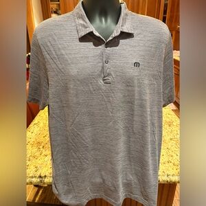 Travis Mathew men’s golf polo.‎ Sharp purple heather with logos front/back.